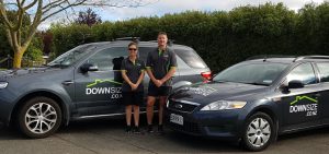 DownSize NZ Owners standing by vehicles
