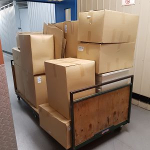 Moving boxes stacked on moving trolly