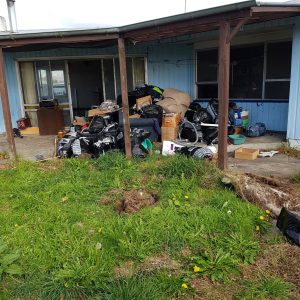 pile of rubbish by house